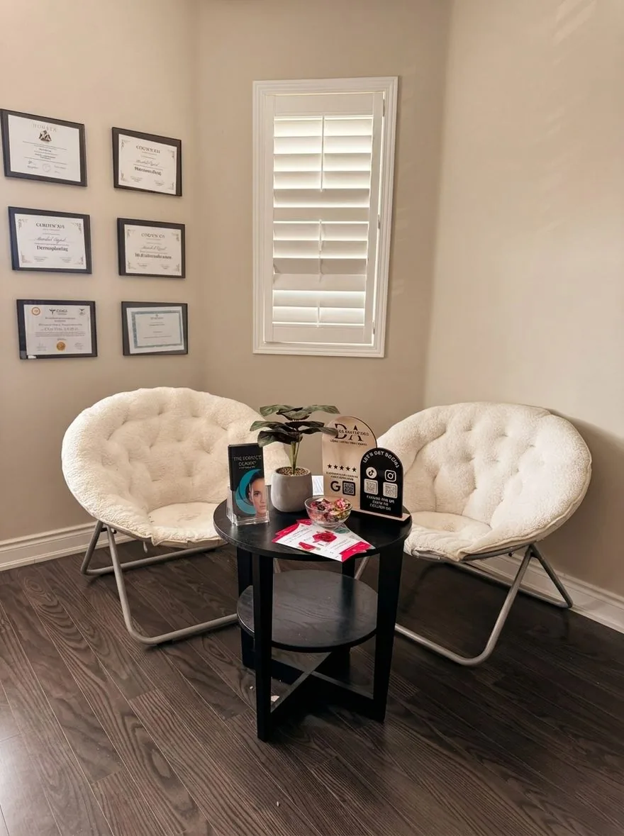 The Demure Aesthetics waiting area with soft bouclé chairs and warm neutral light